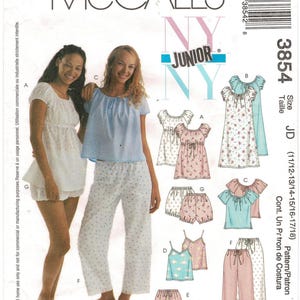 May include: McCall's 3854 sewing pattern for junior sleepwear. The envelope features illustrations of various tops, shorts, and pants with gathered necklines and tie details. Includes options for floral prints, solid colors, and lace trim accents.