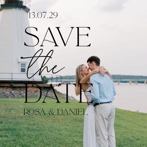May include: A save the date card featuring a couple embracing on a grassy lawn near a white lighthouse and water. The text reads 13.07.29, SAVE the DATE, and ROSA & DANIEL in black serif and script fonts against a soft, overcast outdoor background.