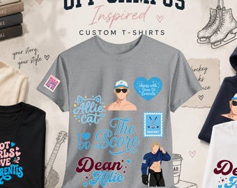 Könnte beinhalten: Ein graues Kurzarm-T-Shirt mit verschiedenen grafischen Aufdrucken, darunter eine Person mit Kappe und Sonnenbrille, ein blaues Herz mit Text, die Wörter Allie Cat, The Score und Dean Allie, ein Hockeyschläger-Symbol und eine Eishockeyspieler-Grafik.