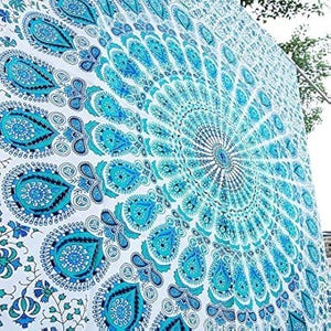 May include: A large fabric wall hanging featuring a white background with a repeating circular mandala pattern in shades of bright turquoise, sky blue, and navy blue. The design includes intricate paisley motifs and floral elements.