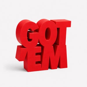 May include: A bright red sculptural object featuring the stacked text GOT EM in a bold, blocky, sans-serif typeface. The letters are three-dimensional with sharp edges and a matte finish, creating a solid, freestanding display piece.