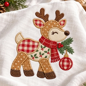May include: A white fabric towel featuring an embroidered reindeer with brown polka-dot fur, a red and white gingham patterned scarf, and a holly sprig. The reindeer holds a red and white gingham Christmas ornament with a gold top.