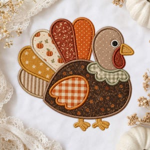 May include: An embroidered turkey applique featuring a patchwork design with various fabric patterns including orange gingham, brown floral, cream pumpkin print, and yellow stars. The turkey has a tan head, a green gingham collar, and yellow feet.
