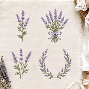 May include: A piece of light beige linen fabric featuring four distinct lavender embroidery designs: a single stem, a tied bouquet with a bow, a three-stem cluster, and a circular wreath, all rendered in shades of purple and sage green.