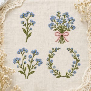 May include: Four distinct embroidery designs on light beige linen fabric featuring blue forget-me-not flowers with yellow centers and green stems. The patterns include two individual floral sprigs, a bouquet tied with a pink ribbon, and a circular wreath.