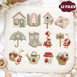 May include: A white quilted fabric square featuring twelve embroidered designs including a house, window, birdhouse, folded quilt, umbrella, rain boots, geese, a sign, a basket of strawberries, a watering can, a jar, and a potted plant.