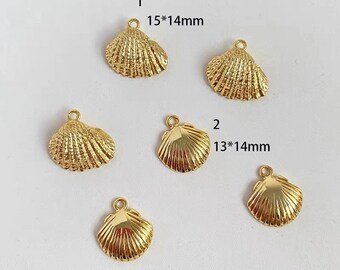 May include: Six gold-colored metal seashell charms. Two of the charms are 15 mm by 14 mm and four are 13 mm by 14 mm.