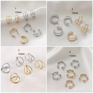 May include: A collection of ear cuffs in gold and silver tones. The ear cuffs have various designs, including triple bands, beaded styles, and geometric shapes. Measurements are provided in millimeters.