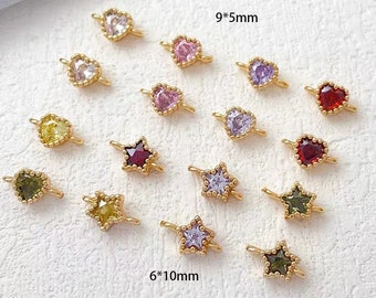May include: Assortment of gold-tone heart and star-shaped charms with colorful crystal accents. The charms are 9 mm by 5 mm and 6 mm by 10 mm in size.
