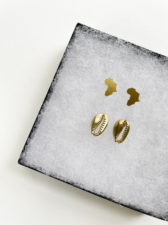 Cowrie and The Continent Brass Stud Set