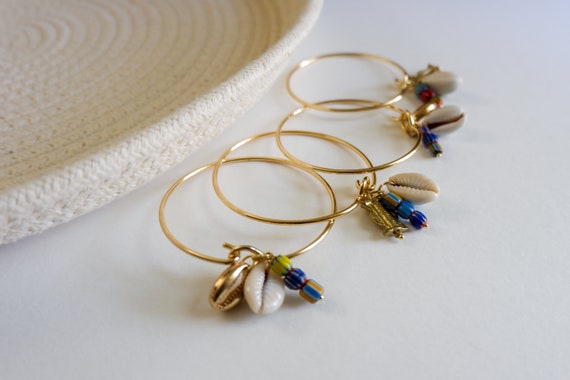 Brass Charm Bangles with Lampwork Beads, Cowrie Shells, and Brass Charms