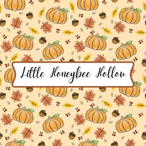 May include: A repeating pattern on a light beige background featuring orange pumpkins, brown acorns, red berries, and yellow and orange autumn leaves. A white rectangular banner with a brown border displays the text Little Honeybee Hollow.