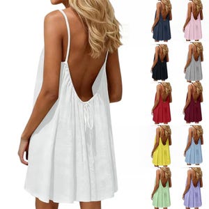 May include: A white sleeveless mini dress featuring a deep open back design with thin spaghetti straps and a gathered, flowing skirt. The dress includes a tie detail at the center back. The image displays the same dress in ten different colors.