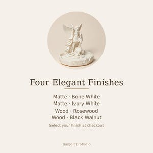 May include: A white figurine of Saint Michael the Archangel defeating a demon, set on a circular base. Text reads: Four Elegant Finishes, Matte Bone White, Matte Ivory White, Wood Rosewood, Wood Black Walnut, Select your finish at checkout, Danjo 3D Studio.