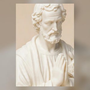 May include: A cream-colored bust sculpture of a bearded man with wavy hair, depicted with hands pressed together in a prayer position. The figure wears a draped garment over the shoulders and holds a lily flower visible near the hands.
