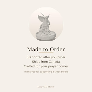 May include: A light gray 3D printed figurine of Saint Michael the Archangel standing over a serpent, featuring detailed wings, armor, and a sword. The text reads: Made to Order, 3D printed after you order, Ships from Canada, Crafted for your prayer corner, Thank you for supporting a small studio, Danjo 3D Studio.