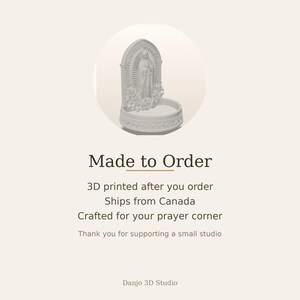 May include: A white 3D printed holy water font featuring a central figure of the Virgin Mary standing within an arched niche, surrounded by sculpted floral details and a circular basin base with decorative trim, presented in a clean, matte finish.