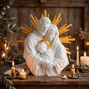 May include: A white sculpture of a family consisting of two adults and a child, with the adults embracing the child. The child has a gold halo, and a large gold sunburst design is positioned behind the figures, creating a radiant effect.