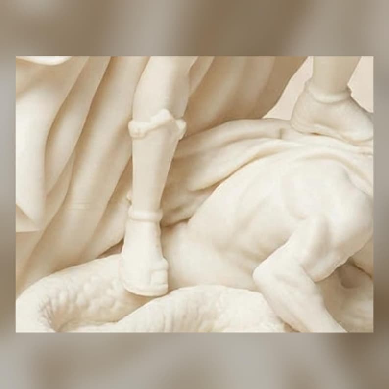May include: A cream-colored sculpture depicting a figure wearing a greave and sandal, standing over a recumbent form with textured, scale-like details. The composition features flowing, draped fabric elements and smooth, carved anatomical surfaces.