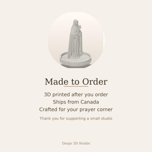 May include: A light gray 3D printed figurine of a robed figure holding a cross, standing on a circular base with the text Saint Fernando inscribed on the front. The figure wears a long cloak and has a hood covering the head, with a cross held in hands.