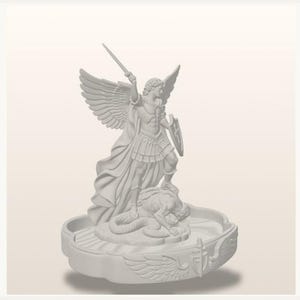 May include: A monochromatic white figurine depicting a winged figure in armor holding a sword aloft and a shield, standing over a prone figure on a circular base. The base features relief carvings of wings and a shield emblem on its outer edge.