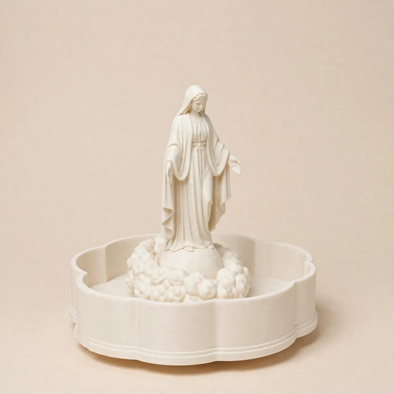 May include: A cream-coloured figurine of a standing figure wearing a long robe and head covering, positioned atop a spherical base surrounded by sculpted clouds, all resting inside a circular, scalloped-edge tray of the same matching colour.