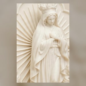 May include: A cream-colored sculpture of a figure wearing a crown and a draped robe, with hands folded over the chest. The figure is positioned in front of a large, circular, sunburst-style halo with radiating rays, all rendered in a smooth, matte finish.