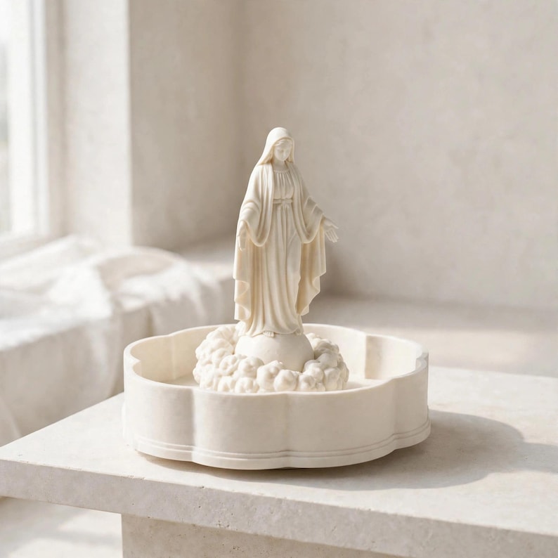 May include: A cream-colored figurine of a standing figure wearing a hooded robe with arms outstretched, positioned atop a small globe surrounded by sculpted clouds, all resting inside a shallow, scalloped-edge circular tray.