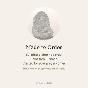 May include: A light gray 3D printed wall-mounted holy water font featuring a central figure of the Virgin Mary standing on a crescent moon, surrounded by clouds and rays of light, with a scalloped shell-shaped basin at the bottom.