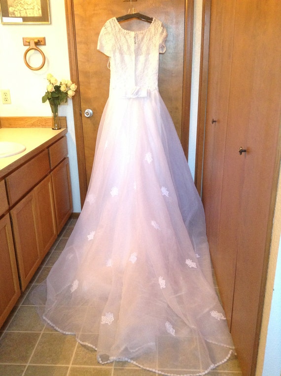 Beautiful beaded wedding dress with train.