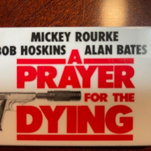 Promotional button for movie, A Prayer for the Dying.