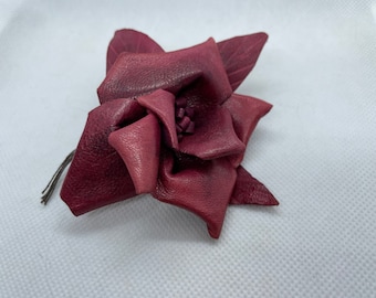 Red leather rose pin.