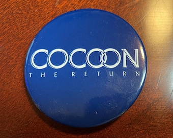 Promotional button for movie, Cocoon, the Return.