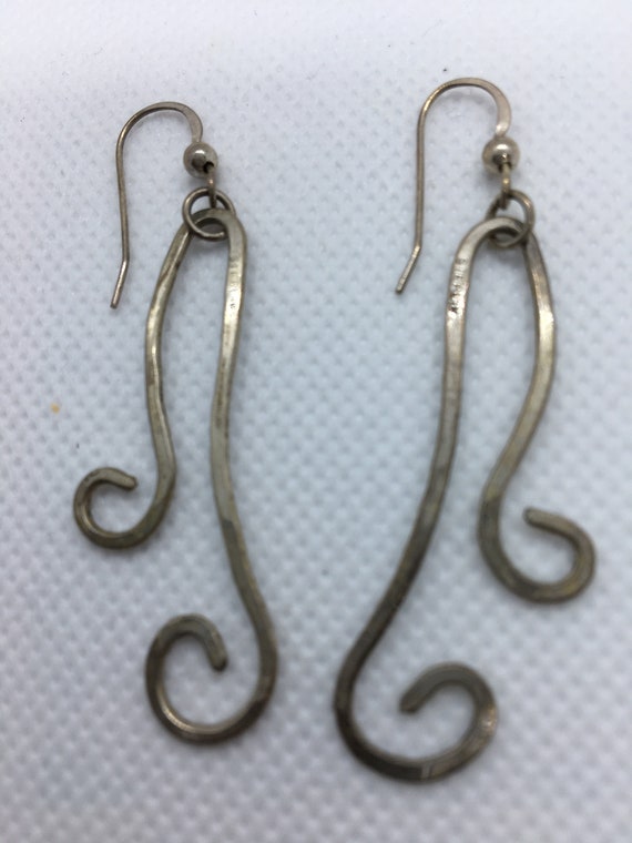 Silver hammered earrings.
