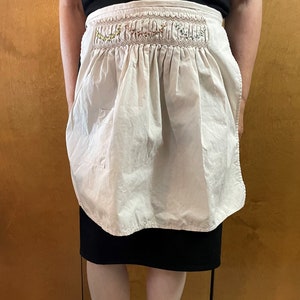 Beige Smocked Apron.