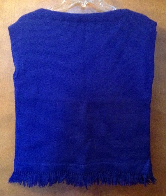 Blue wool vest or top.