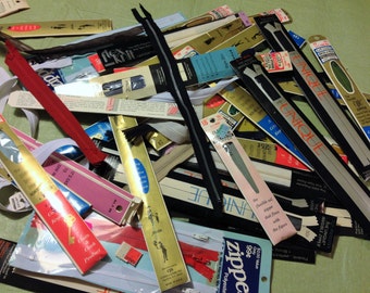Around 4 dozen vintage zippers.