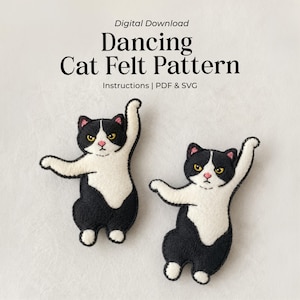 May include: Digital download Dancing Cat Felt Pattern Instructions | PDF & SVG. Two black and white felt cat figures in a dancing pose with yellow eyes and pink noses. The cats have black ears, heads, and bodies with white chest and paw details.