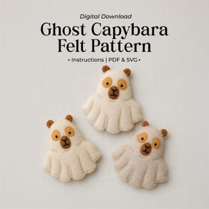 May include: Digital download for a Ghost Capybara felt pattern including instructions, PDF, and SVG files. Three off-white felt capybara figures shaped like ghosts with brown ears, brown eye patches, and brown noses are displayed on a light background.