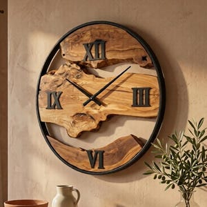 May include: A round wall clock featuring a natural live-edge wood slab face encased in a thin black metal frame. The clock displays black metal Roman numerals at the twelve, three, six, and nine o'clock positions with matching black hands.