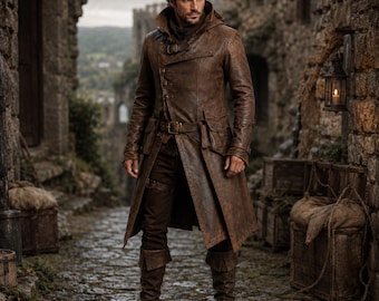 May include: A distressed brown leather trench coat featuring a high collar, a buckled strap at the neck, a waist belt with a metal buckle, and two large flap pockets. The coat is worn over dark trousers and tall brown leather boots.