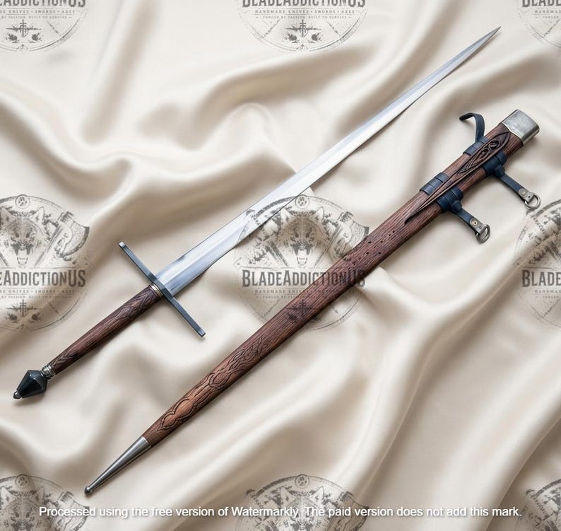 May include: A long, double-edged steel sword with a straight crossguard and a dark brown, textured wooden grip ending in a faceted pommel. Beside it lies a matching wooden scabbard featuring intricate carvings and dark leather suspension straps.
