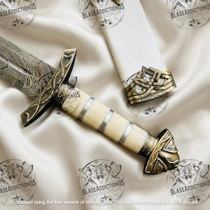 May include: A dagger with a patterned Damascus steel blade and a cream-coloured handle featuring silver bands. The crossguard and pommel are made of antique-finished brass with intricate knotwork designs. A matching brass-accented sheath is included.
