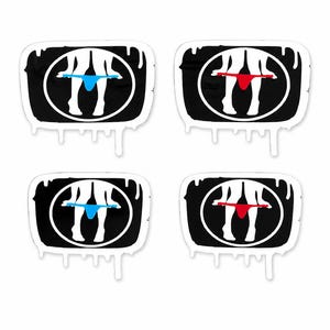 May include: Four rectangular stickers with rounded corners, each featuring a black background with a white circular graphic of legs and a thong. Two stickers show a light blue thong, and two stickers show a red thong. The edges have a white drip effect.