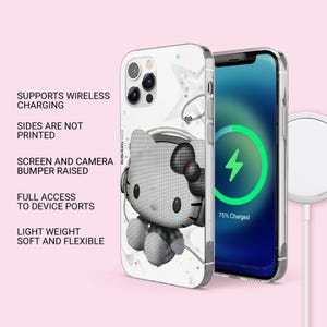 May include: A clear phone case featuring a black and white Hello Kitty graphic with headphones. The case supports wireless charging, has raised bumpers for the screen and camera, provides full port access, and is lightweight, soft, and flexible.