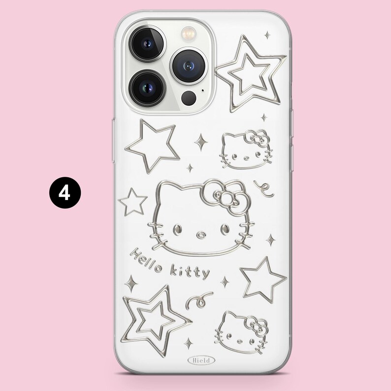 May include: A clear smartphone case featuring a silver-toned embossed design of Hello Kitty faces, various star shapes, and small sparkles. The text Hello kitty is printed in a silver font, and the word Hield is visible at the bottom center.
