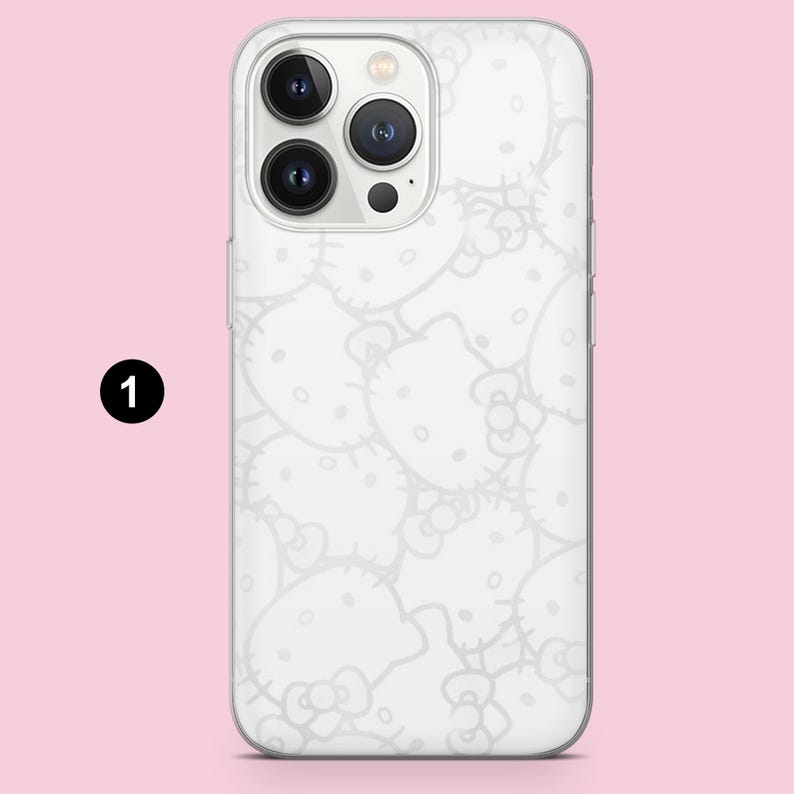 May include: A clear smartphone case featuring a repeating white outline pattern of the Hello Kitty character. The case is shown on a smartphone with a triple-lens camera system on the back. The design covers the entire back surface of the phone case.