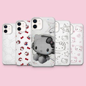 May include: Five clear smartphone cases featuring Hello Kitty designs. One case shows a large grayscale Hello Kitty with headphones, while others display repeating patterns of Hello Kitty faces, red bows, stars, and hearts in various line art styles.