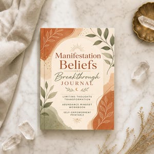 May include: A rectangular journal with a cream-colored cover featuring an arch design, botanical illustrations in green and terracotta, and the text: Manifestation Beliefs Breakthrough JOURNAL, LIMITING THOUGHTS TRANSFORMATION, ABUNDANCE MINDSET WORKBOOK, SELF-EMPOWERMENT PRINTABLE.