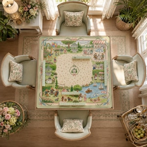 May include: A square mahjong table featuring a light green border and a central play surface decorated with a detailed illustration of anthropomorphic animals in a park setting, surrounded by four upholstered chairs with floral pillows.